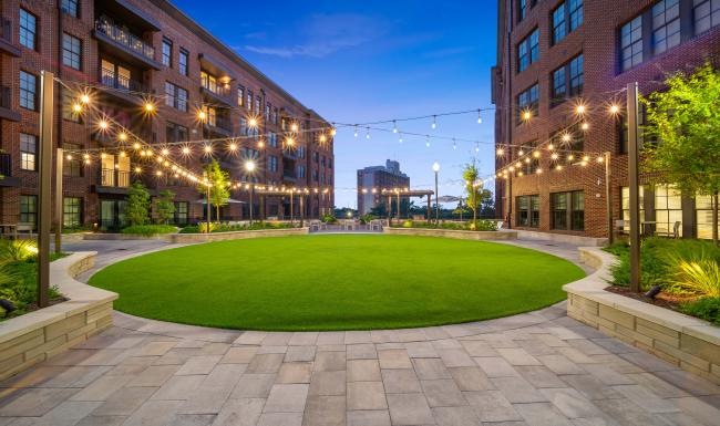 Settle into comfort at Cormac a courtyard with buildings and trees