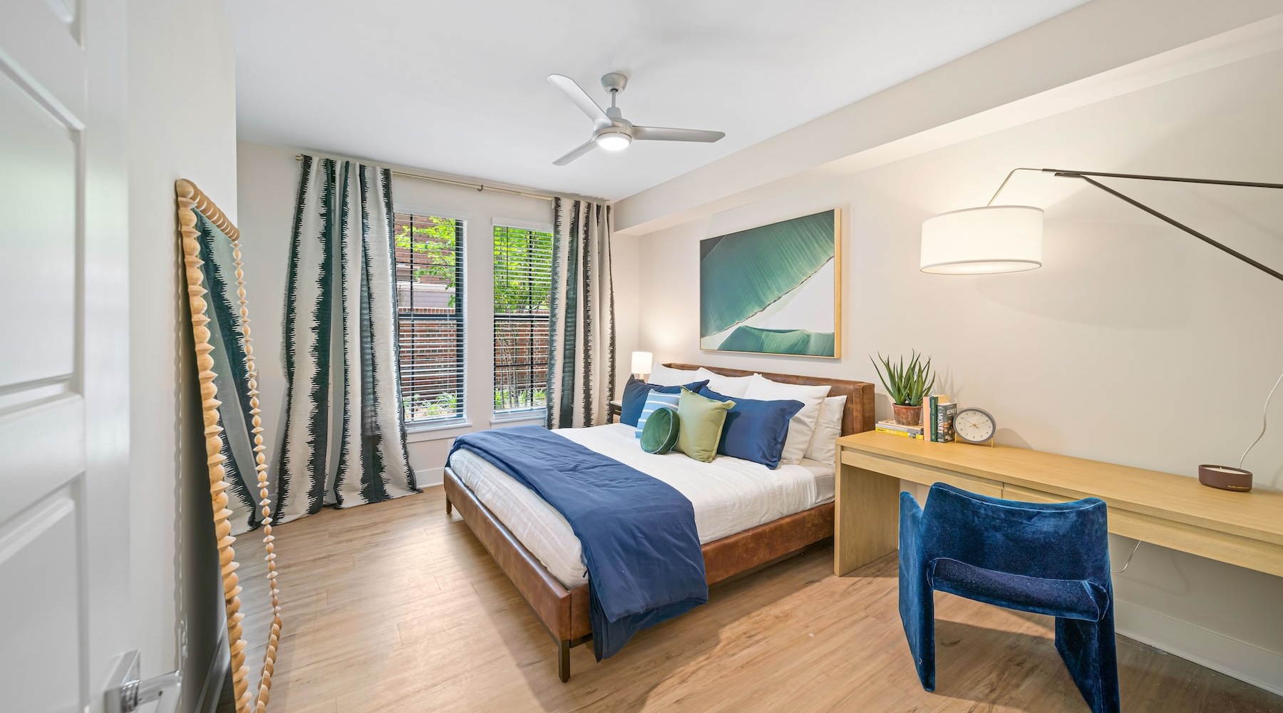 Beautiful bedrooms to fit every need a bedroom with a bed and a desk with a chair