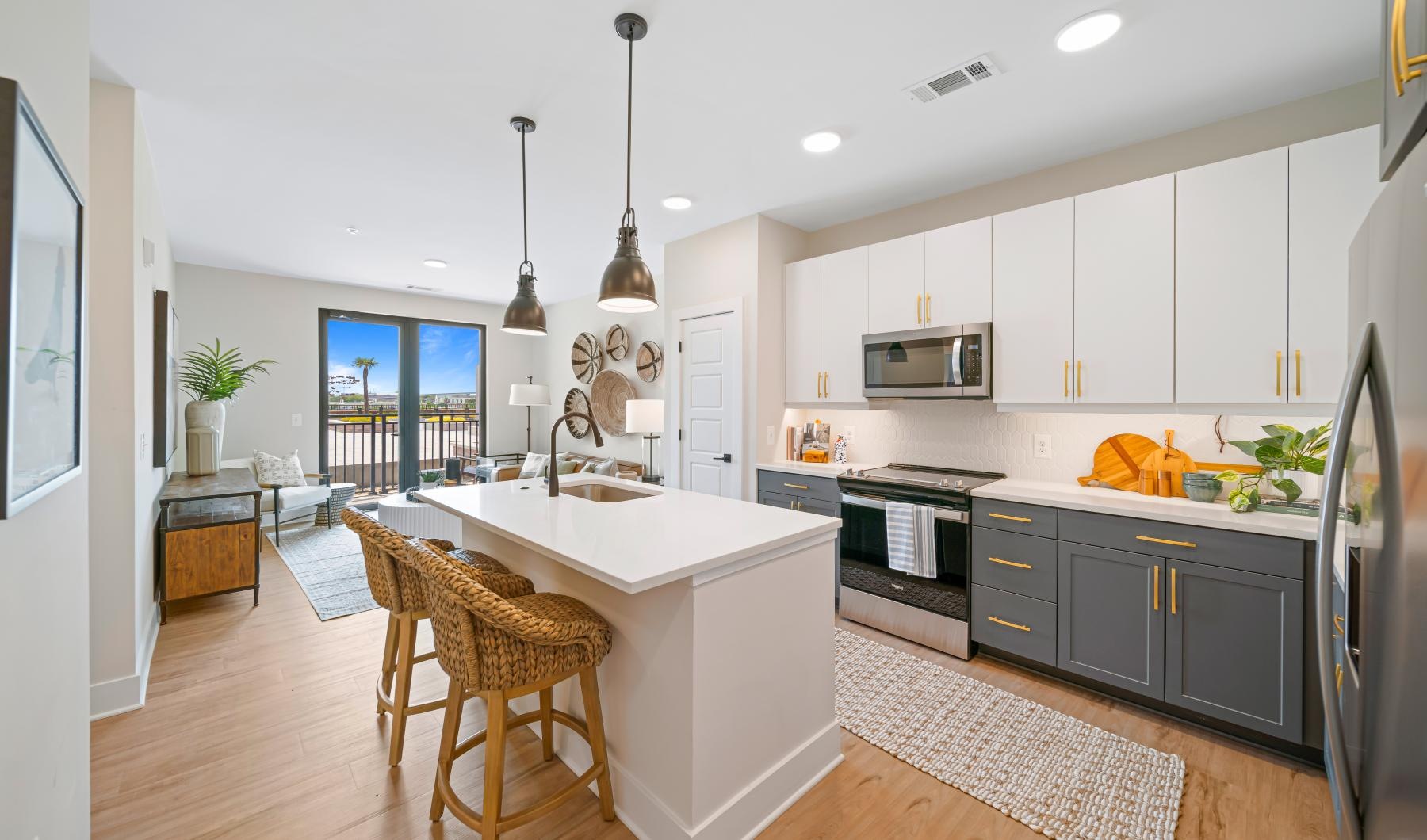 Beautiful kitchens with designer finishes a kitchen with an island and chairs