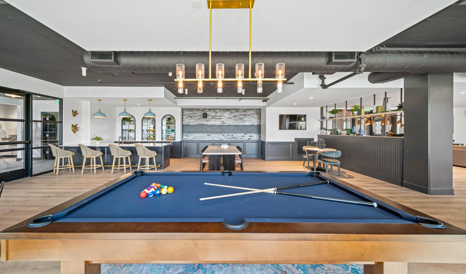 a pool table in a clubhouse room